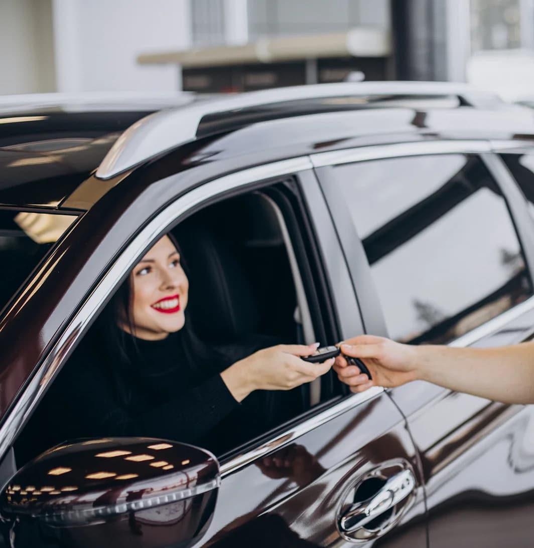 Happy customer receiving car keys